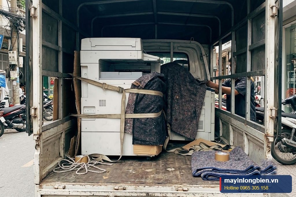 Chằng buộc máy photocopy cố định trên xe tải