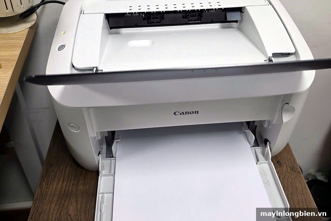 Máy in Canon 6030 nạp giấy in thử sau khi sửa xong Máy in Canon 6030 nạp giấy in thử sau khi sửa xong